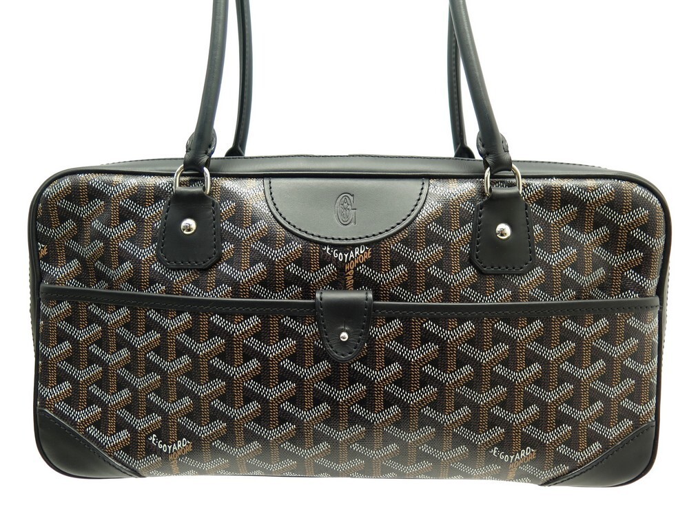 Attribué à Goyard. Sac de voyage en toile tissée et cuir…