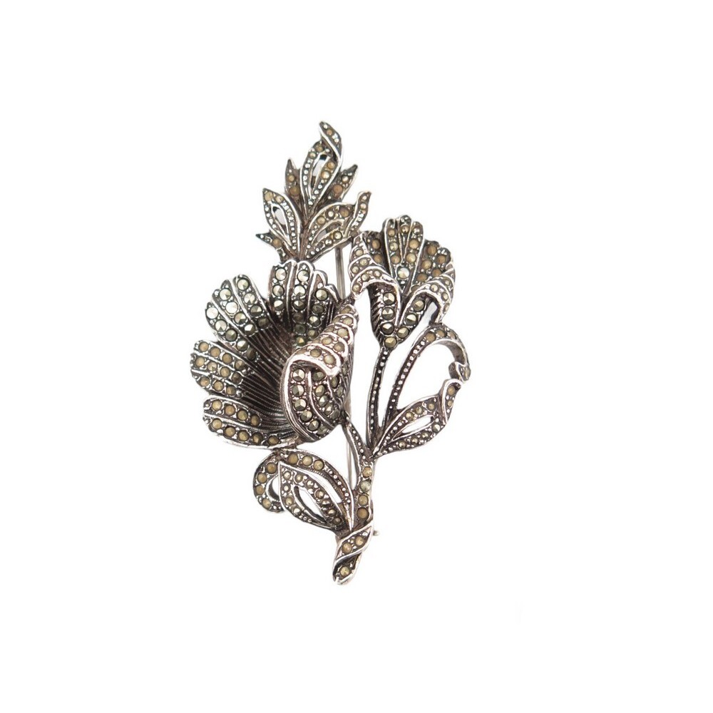 broche saint laurent fleurs en metal argente